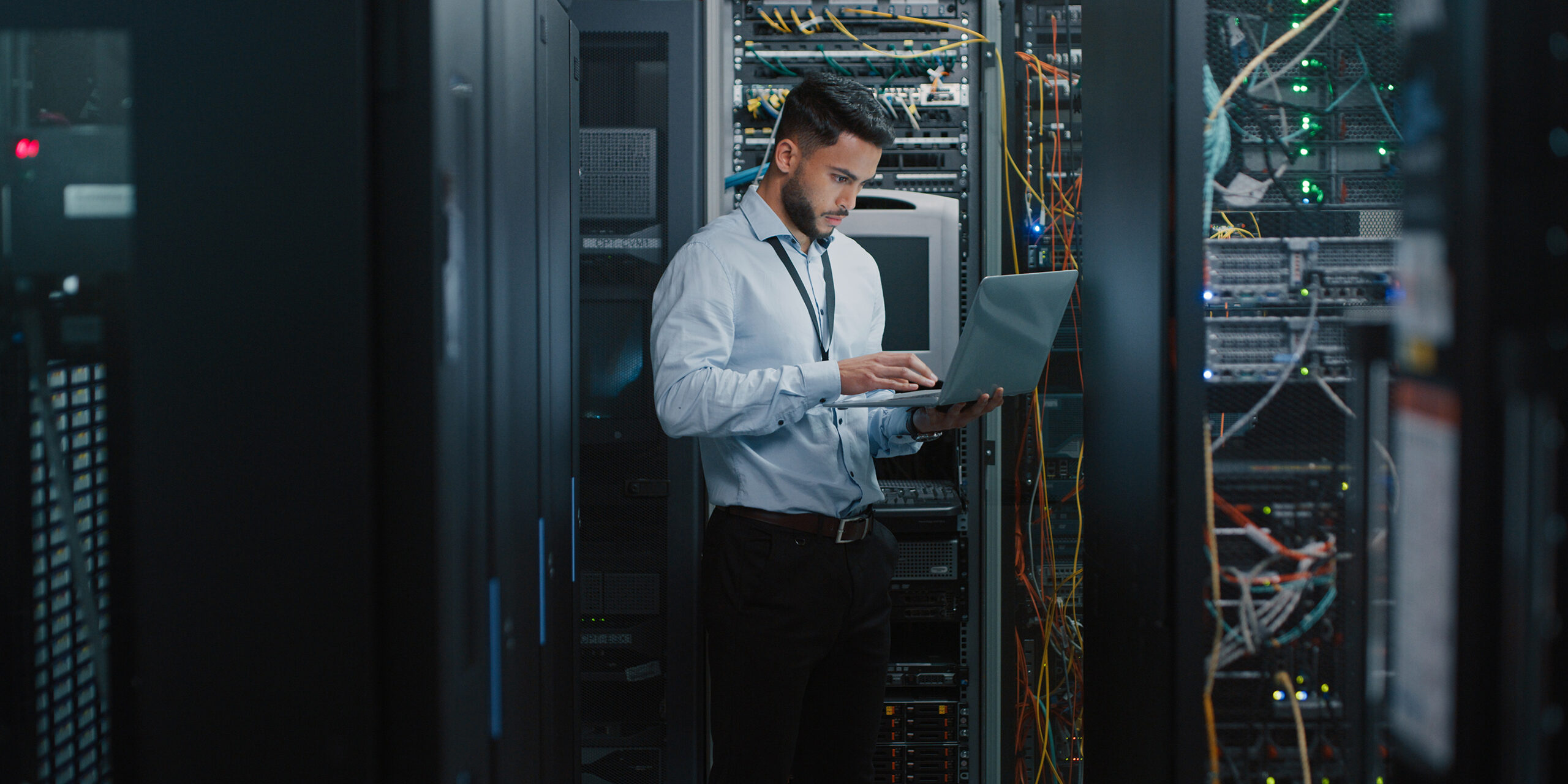 As an IT service provider in Michigan, Nordicom Technologies provides a wide array of solutions. This is an image of an IT professional in a server room.